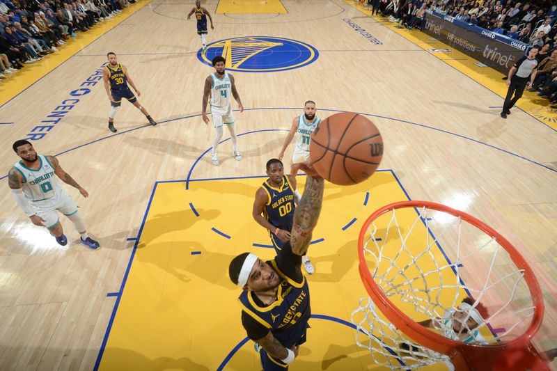 SAN FRANCISCO, CA - FEBRUARY 23: Gary Payton II #0 of the Golden State Warriors dunks the ball during the game against the Charlotte Hornets on February 23, 2024 at Chase Center in San Francisco, California. NOTE TO USER: User expressly acknowledges and agrees that, by downloading and or using this photograph, user is consenting to the terms and conditions of Getty Images License Agreement. Mandatory Copyright Notice: Copyright 2024 NBAE (Photo by Noah Graham/NBAE via Getty Images)