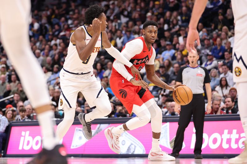 DENVER, COLORADO - NOVEMBER 04: RJ Barrett #9 of the Toronto Raptors drives to the basket against Peyton Watson #8 of the Denver Nuggets in the fourth quarter at Ball Arena on November 4, 2024 in Denver, Colorado. NOTE TO USER: User expressly acknowledges and agrees that, by downloading and/or using this Photograph, user is consenting to the terms and conditions of the Getty Images License Agreement. Mandatory Copyright Notice: Copyright 2024 NBAE (Photo by Justin Tafoya/Getty Images)