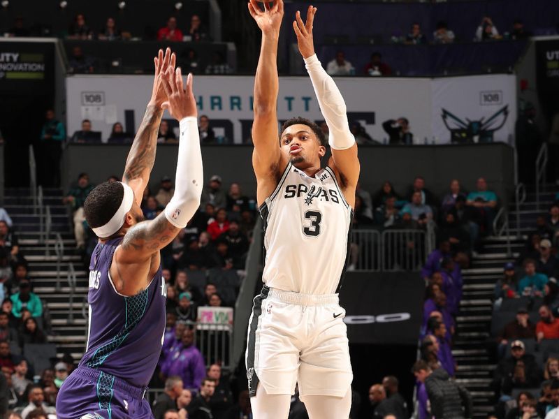 CHARLOTTE, NC - JANUARY 19: Keldon Johnson #3 of the San Antonio Spurs shoots a three point basket during the game against the Charlotte Hornets on January 19, 2024 at Spectrum Center in Charlotte, North Carolina. NOTE TO USER: User expressly acknowledges and agrees that, by downloading and or using this photograph, User is consenting to the terms and conditions of the Getty Images License Agreement. Mandatory Copyright Notice: Copyright 2024 NBAE (Photo by Kent Smith/NBAE via Getty Images)