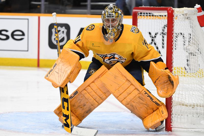 Jan 31, 2024; Nashville, Tennessee, USA; Nashville Predators goaltender Juuse Saros (74) watches the puck during the second period against the Los Angeles Kings at Bridgestone Arena. Mandatory Credit: Christopher Hanewinckel-USA TODAY Sports