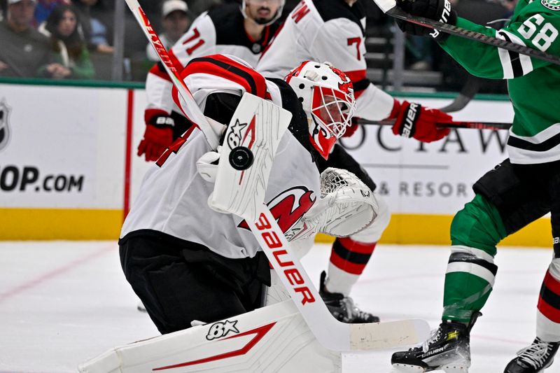 Mar 24, 2026; Dallas, Texas, USA; New Jersey Devils goaltender Jake Allen (34) makes a pad save on a Dallas Stars shot during the second period at the American Airlines Center. Mandatory Credit: Jerome Miron-Imagn Images