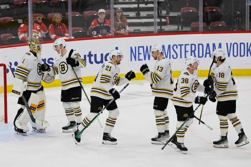 May 6, 2024; Sunrise, Florida, USA; Boston Bruins players celebrate with goaltender Jeremy Swayman (1) after defeating the Florida Panthers in game one of the second round of the 2024 Stanley Cup Playoffs at Amerant Bank Arena. Mandatory Credit: Sam Navarro-USA TODAY Sports