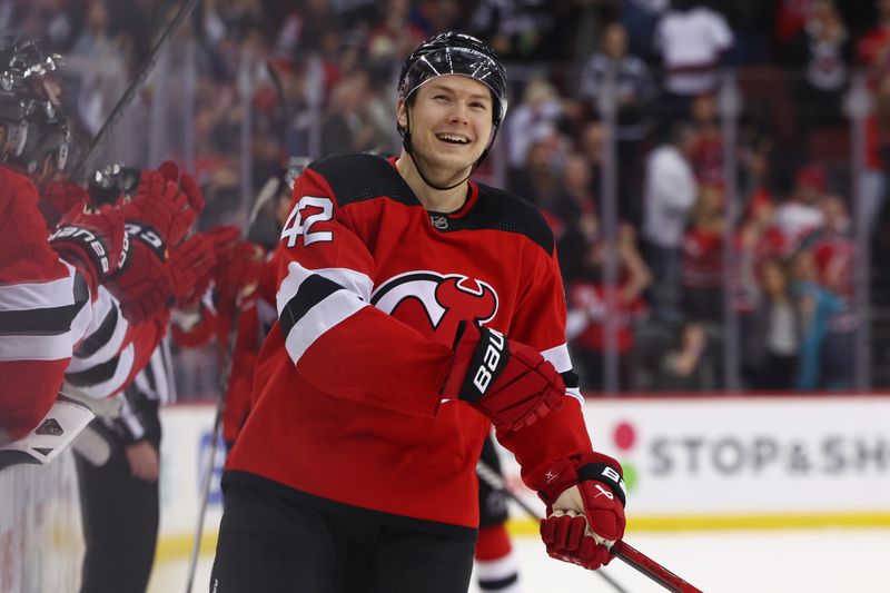 Nov 28, 2023; Newark, New Jersey, USA; New Jersey Devils center Curtis Lazar (42) celebrates his goal against the New York Islanders during the third period at Prudential Center. Mandatory Credit: Ed Mulholland-USA TODAY Sports