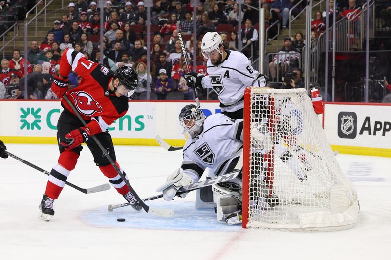 Feb 23, 2023; Newark, New Jersey, USA; New Jersey Devils center Yegor Sharangovich (17) tries to gather the puck after a save by Los Angeles Kings goaltender Pheonix Copley (29) during the second period at Prudential Center. Mandatory Credit: Ed Mulholland-USA TODAY Sports