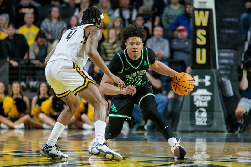 Jan 4, 2024; Wichita, Kansas, USA; North Texas Mean Green guard CJ Noland (22) drives around Wichita State Shockers guard Colby Rogers (4) during the second half at Charles Koch Arena. Mandatory Credit: William Purnell-USA TODAY Sports