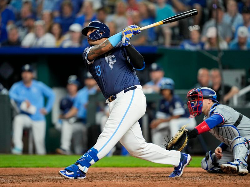 May 3, 2024; Kansas City, Missouri, USA; Kansas City Royals first baseman Salvador Perez (13) hits a home run during the seventh inning against the Texas Rangers at Kauffman Stadium. Mandatory Credit: Jay Biggerstaff-USA TODAY Sports