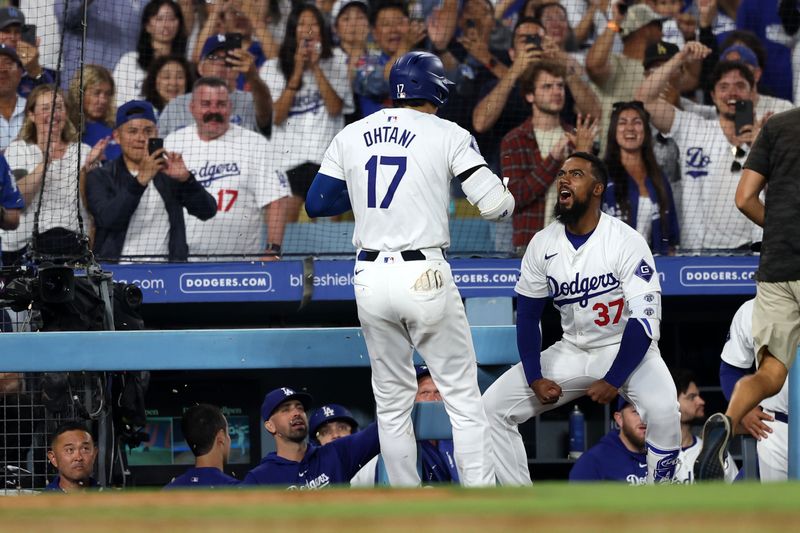 Jul 2, 2024; Los Angeles, California, USA;  Los Angeles Dodgers designated hitter Shohei Ohtani (17) is greeted by left fielder Teoscar Hernandez (37) after hitting a two-run home run during the seventh inning against the Arizona Diamondbacks at Dodger Stadium. Mandatory Credit: Kiyoshi Mio-USA TODAY Sports