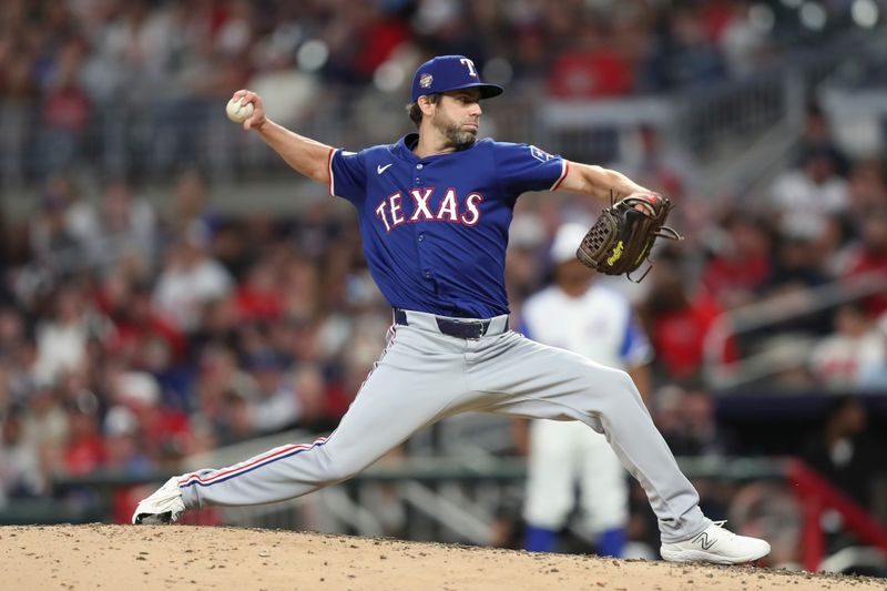 Apr 20, 2024; Cumberland, Georgia, USA;  Texas Rangers relief pitcher Austin Pruitt (49) pitches against the Atlanta Braves in the eighth inning at Truist Park. Mandatory Credit: Mady Mertens-USA TODAY Sports