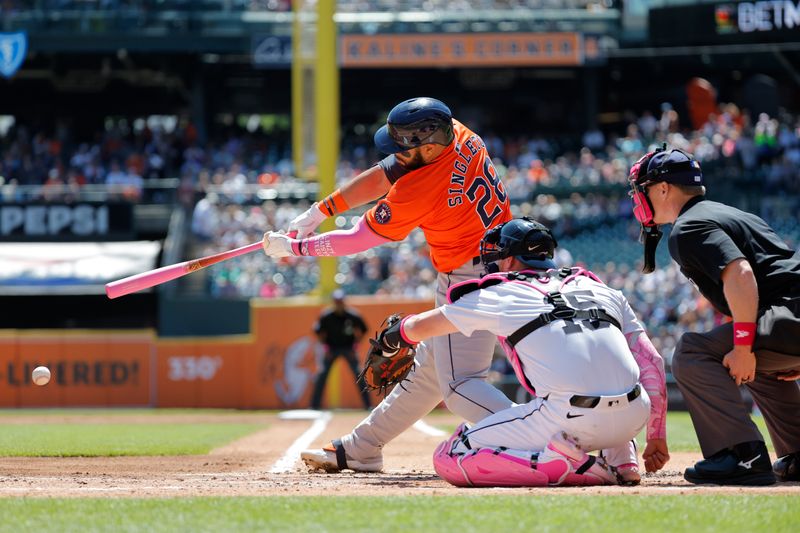 May 12, 2024; Detroit, Michigan, USA;  Houston Astros first baseman Jon Singleton (28) hits a single in the second inning against the Detroit Tigers at Comerica Park. Mandatory Credit: Rick Osentoski-USA TODAY Sports