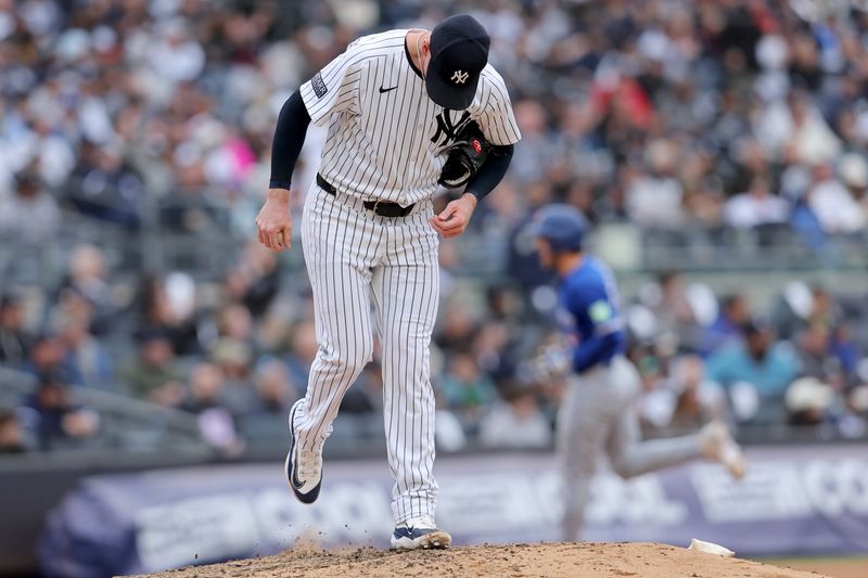 Apr 5, 2024; Bronx, New York, USA; New York Yankees relief pitcher Caleb Ferguson (64) reacts after giving up a solo home run to Toronto Blue Jays shortstop Ernie Clement (28) during the seventh inning at Yankee Stadium. Mandatory Credit: Brad Penner-USA TODAY Sports