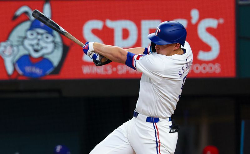 Jul 24, 2024; Arlington, Texas, USA; Texas Rangers shortstop Corey Seager (5) hits a home run during the first inning against the Chicago White Sox at Globe Life Field. Mandatory Credit: Kevin Jairaj-USA TODAY Sports