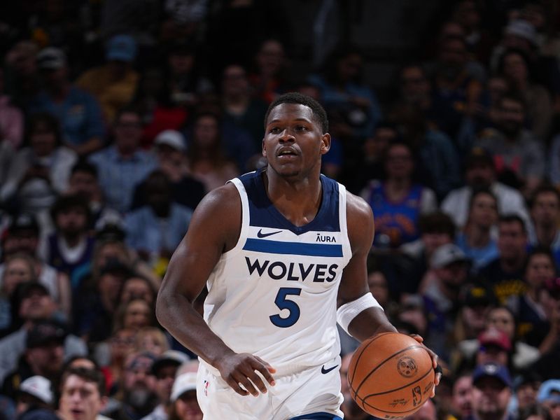 DENVER, CO - APRIL 10: Anthony Edwards #5 of the Minnesota Timberwolves dribbles the ball during the game against the Denver Nuggets on April 10, 2024 at the Ball Arena in Denver, Colorado. NOTE TO USER: User expressly acknowledges and agrees that, by downloading and/or using this Photograph, user is consenting to the terms and conditions of the Getty Images License Agreement. Mandatory Copyright Notice: Copyright 2024 NBAE (Photo by Garrett Ellwood/NBAE via Getty Images)