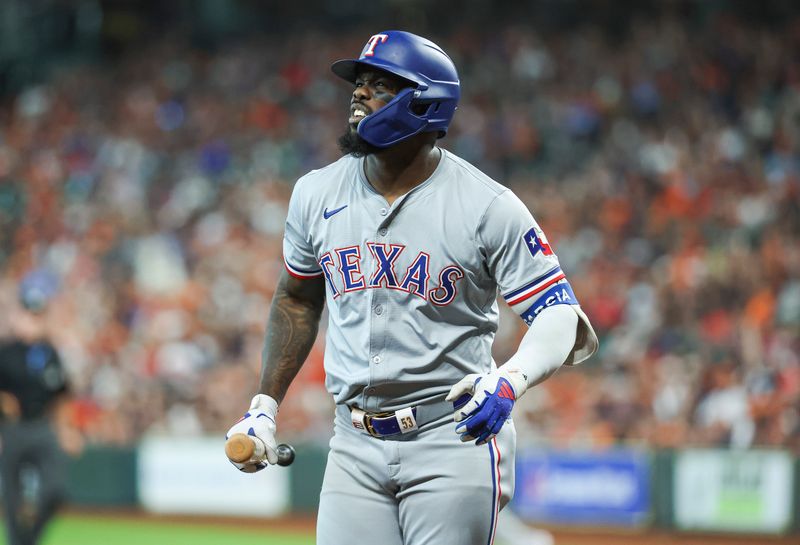 Apr 14, 2024; Houston, Texas, USA; Texas Rangers right fielder Adolis Garcia (53) reacts after striking out during the first inning against the Houston Astros at Minute Maid Park. Mandatory Credit: Troy Taormina-USA TODAY Sports