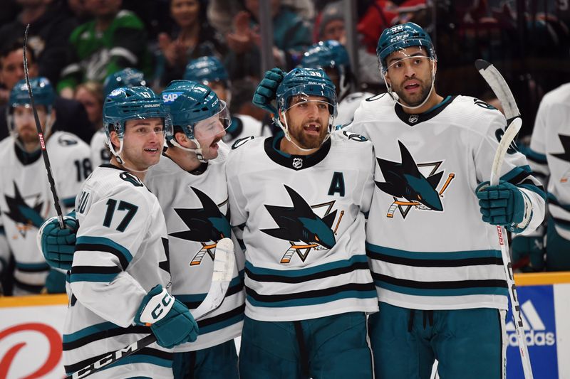 Mar 19, 2024; Nashville, Tennessee, USA; San Jose Sharks defenseman Mario Ferraro (38) celebrates with teammates after a goal during the second period against the Nashville Predators at Bridgestone Arena. Mandatory Credit: Christopher Hanewinckel-USA TODAY Sports