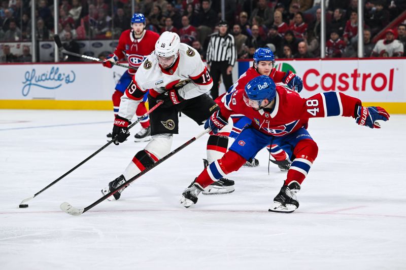 Oct 12, 2024; Montreal, Quebec, CAN; Ottawa Senators right wing Drake Batherson (19) plays the puck against Montreal Canadiens defenseman Lane Hutson (48) during the second period at Bell Centre. Mandatory Credit: David Kirouac-Imagn Images