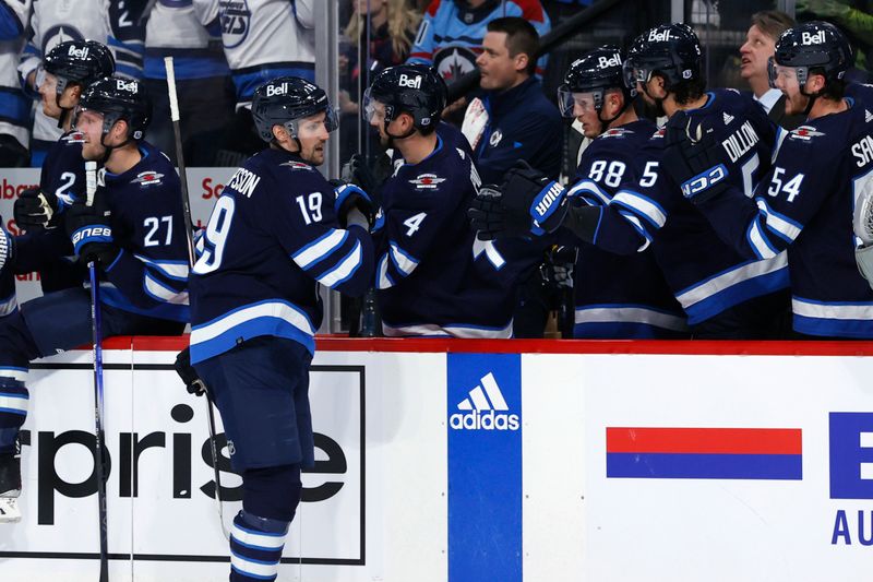 Oct 30, 2023; Winnipeg, Manitoba, CAN; Winnipeg Jets center David Gustafsson (19) celebrates his first period goal against the New York Rangers at Canada Life Centre. Mandatory Credit: James Carey Lauder-USA TODAY Sports