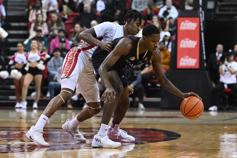 Feb 14, 2023; Las Vegas, Nevada, USA; UNLV Runnin' Rebels guard Keshon Gilbert (10) defends against San Jose State Spartans guard Omari Moore (10) in the second half at Thomas & Mack Center. Mandatory Credit: Candice Ward-USA TODAY Sports