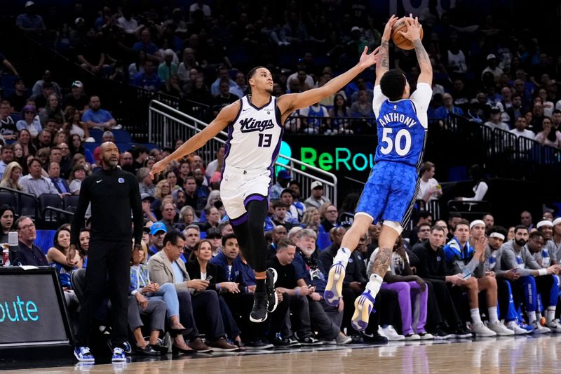 ORLANDO, FLORIDA - MARCH 23: Cole Anthony #50 of the Orlando Magic steals a pass intended for Keegan Murray #13 of the Sacramento Kings during the first quarter at Kia Center on March 23, 2024 in Orlando, Florida. NOTE TO USER: User expressly acknowledges and agrees that, by downloading and or using this photograph, User is consenting to the terms and conditions of the Getty Images License Agreement. (Photo by Rich Storry/Getty Images)