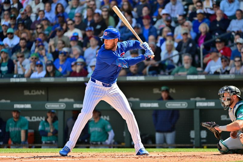 Mar 8, 2024; Mesa, Arizona, USA;  Chicago Cubs center fielder Cody Bellinger (24) at bat in the first inning against the Seattle Mariners during a spring training game at Sloan Park. Mandatory Credit: Matt Kartozian-USA TODAY Sports