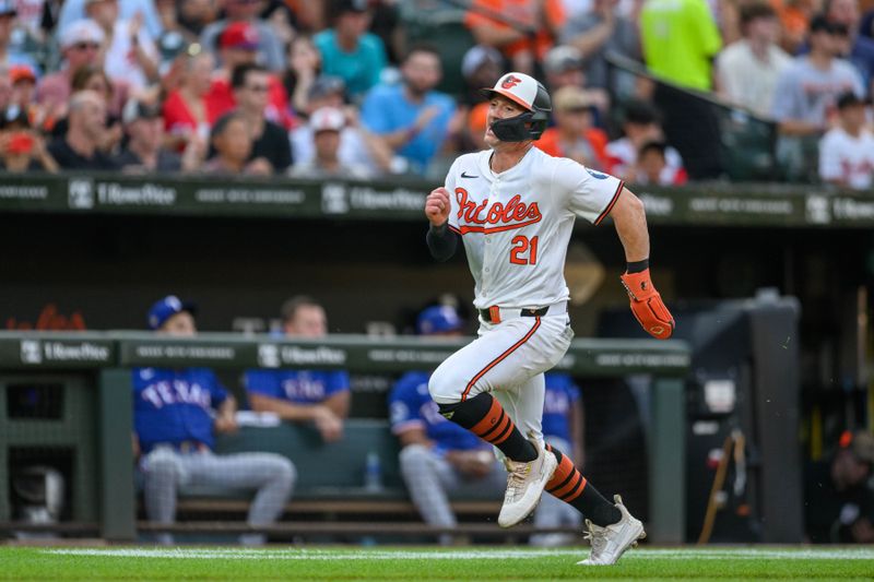 Jun 30, 2024; Baltimore, Maryland, USA; Baltimore Orioles outfielder Austin Hays (21) scores a run during the second inning against the Texas Rangers at Oriole Park at Camden Yards. Mandatory Credit: Reggie Hildred-USA TODAY Sports