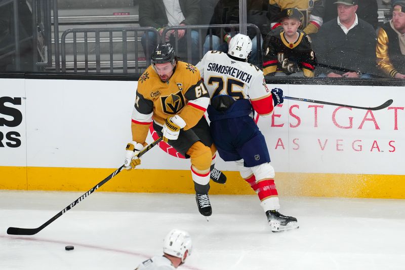 Jan 26, 2025; Las Vegas, Nevada, USA; Vegas Golden Knights right wing Mark Stone (61) slips the check attempt of Florida Panthers right wing Mackie Samoskevich (25) during the third period at T-Mobile Arena. Mandatory Credit: Stephen R. Sylvanie-Imagn Images