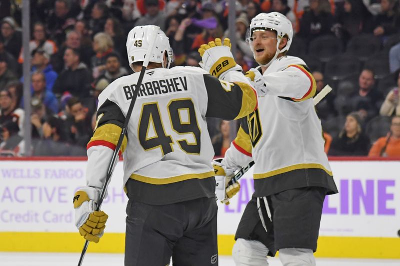 Nov 25, 2024; Philadelphia, Pennsylvania, USA; Vegas Golden Knights center Ivan Barbashev (49) celebrates his goal with center Jack Eichel (9) against the Philadelphia Flyers during the second period at Wells Fargo Center. Mandatory Credit: Eric Hartline-Imagn Images