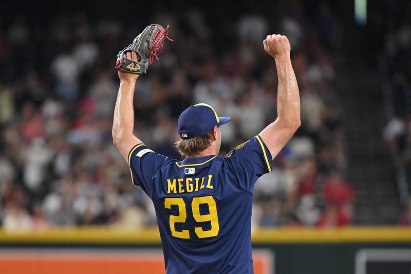 Apr 11, 2025; Phoenix, Arizona, USA; Milwaukee Brewers pitcher Trevor Megill (29) celebrates after beating the Arizona Diamondbacks at Chase Field. Mandatory Credit: Matt Kartozian-Imagn Images