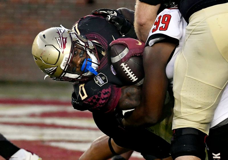 Nov 6, 2021; Tallahassee, Florida, USA; Florida State Seminoles running back Jashaun Corbin (0) is stopped during the fourth quarter against the North Carolina State Wolfpack at Doak S. Campbell Stadium. Mandatory Credit: Melina Myers-USA TODAY Sports