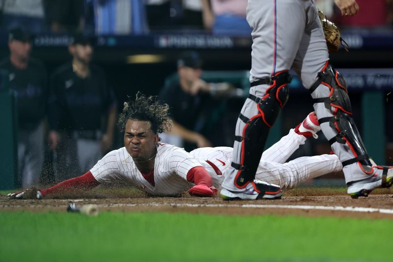 Oct 4, 2023; Philadelphia, Pennsylvania, USA; Philadelphia Phillies left fielder Cristian Pache (19) slides safely into home plate against the Miami Marlins during the third inning for game two of the Wildcard series for the 2023 MLB playoffs at Citizens Bank Park. Mandatory Credit: Bill Streicher-USA TODAY Sports