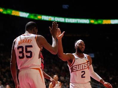 TORONTO, CANADA - NOVEMBER 29:  Kevin Durant #35 of the Phoenix Suns & Josh Okogie #2 of the Phoenix Suns high five during the game  on November 29, 2023 at the Scotiabank Arena in Toronto, Ontario, Canada.  NOTE TO USER: User expressly acknowledges and agrees that, by downloading and or using this Photograph, user is consenting to the terms and conditions of the Getty Images License Agreement.  Mandatory Copyright Notice: Copyright 2023 NBAE (Photo by Mark Blinch/NBAE via Getty Images)