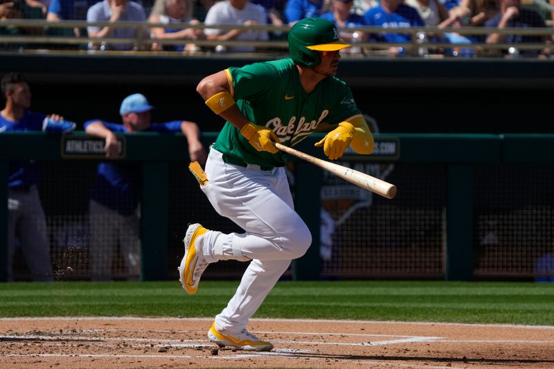 Mar 10, 2024; Mesa, Arizona, USA; Oakland Athletics first baseman Ryan Noda (49) hits against the Kansas City Royals in the first inning at Hohokam Stadium. Mandatory Credit: Rick Scuteri-USA TODAY Sports