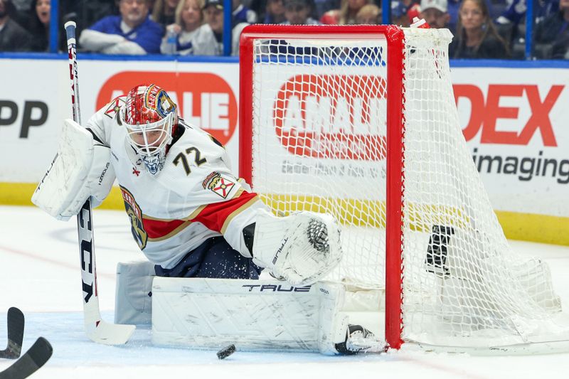 Feb 17, 2024; Tampa, Florida, USA;  Florida Panthers goaltender Sergei Bobrovsky (72) makes a save against the Tampa Bay Lightning in the first period at Amalie Arena. Mandatory Credit: Nathan Ray Seebeck-USA TODAY Sports