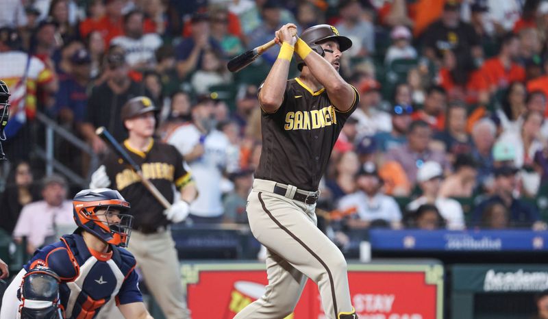 Sep 10, 2023; Houston, Texas, USA; San Diego Padres designated hitter Matt Carpenter (14) hits a home run during the sixth inning against the Houston Astros at Minute Maid Park. Mandatory Credit: Troy Taormina-USA TODAY Sports