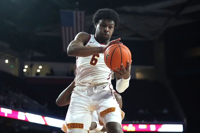 Jan 10, 2024; Los Angeles, California, USA; Southern California Trojans guard Bronny James (6) rebounds the ball against the Washington State Cougars in the first half at Galen Center. Mandatory Credit: Kirby Lee-USA TODAY Sports