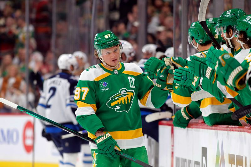 Apr 6, 2024; Saint Paul, Minnesota, USA;  Minnesota Wild left wing Kirill Kaprizov (97) celebrates with teammates after scoring a goal against the Winnipeg Jets during the first period at Xcel Energy Center. Mandatory Credit: Bruce Fedyck-USA TODAY Sports