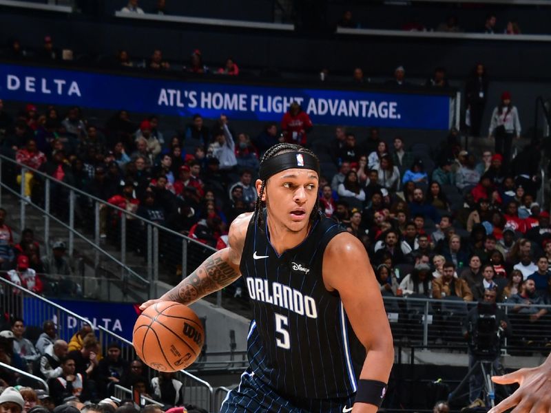 ATLANTA, GA - JANUARY 17: Paolo Banchero #5 of the Orlando Magic goes to the basket during the game on January 17, 2024 at State Farm Arena in Atlanta, Georgia.  NOTE TO USER: User expressly acknowledges and agrees that, by downloading and/or using this Photograph, user is consenting to the terms and conditions of the Getty Images License Agreement. Mandatory Copyright Notice: Copyright 2024 NBAE (Photo by Scott Cunningham/NBAE via Getty Images)