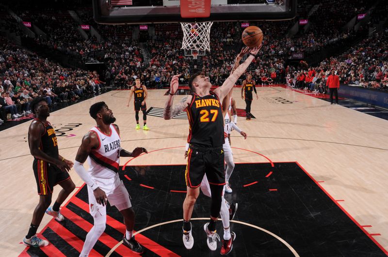 PORTLAND, OR - MARCH 13:  Vit Krejci #27 of the Atlanta Hawks goes to the basket during the game on March 13, 2024 at the Moda Center Arena in Portland, Oregon. NOTE TO USER: User expressly acknowledges and agrees that, by downloading and or using this photograph, user is consenting to the terms and conditions of the Getty Images License Agreement. Mandatory Copyright Notice: Copyright 2024 NBAE (Photo by Cameron Browne/NBAE via Getty Images)