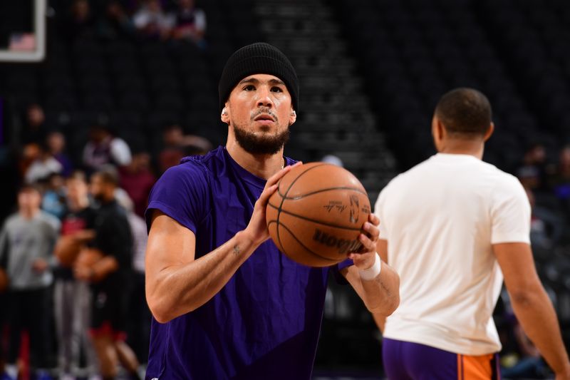 PHOENIX, AZ - FEBRUARY 29: Devin Booker #1 of the Phoenix Suns warms up before the game against the Houston Rockets on February 29, 2023 at Footprint Center in Phoenix, Arizona. NOTE TO USER: User expressly acknowledges and agrees that, by downloading and or using this photograph, user is consenting to the terms and conditions of the Getty Images License Agreement. Mandatory Copyright Notice: Copyright 2023 NBAE (Photo by Kate Frese/NBAE via Getty Images)