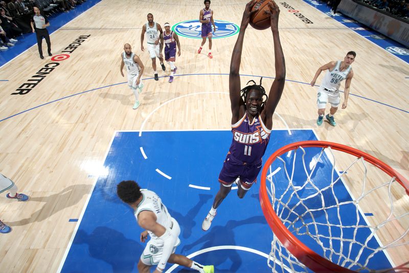 MINNEAPOLIS, MN -  APRIL 20: Bol Bol #11 of the Phoenix Suns handles the ball during Round One Game One of the 2024 NBA Playoffs against the Minnesota Timberwolves on April 20, 2024 at Target Center in Minneapolis, Minnesota. NOTE TO USER: User expressly acknowledges and agrees that, by downloading and or using this Photograph, user is consenting to the terms and conditions of the Getty Images License Agreement. Mandatory Copyright Notice: Copyright 2024 NBAE (Photo by Jordan Johnson/NBAE via Getty Images)