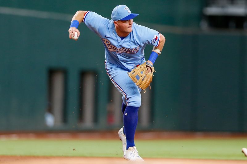 Aug 6, 2023; Arlington, Texas, USA; Texas Rangers third baseman Josh Jung (6) fields a ground ball during the first inning against the Miami Marlins at Globe Life Field. Mandatory Credit: Andrew Dieb-USA TODAY Sports