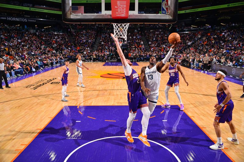 PHOENIX, AZ - JANUARY 7: Jaren Jackson Jr. #13 of the Memphis Grizzlies shoots the ball during the game against the Phoenix Suns on January 7, 2024 at Footprint Center in Phoenix, Arizona. NOTE TO USER: User expressly acknowledges and agrees that, by downloading and or using this photograph, user is consenting to the terms and conditions of the Getty Images License Agreement. Mandatory Copyright Notice: Copyright 2024 NBAE (Photo by Barry Gossage/NBAE via Getty Images)