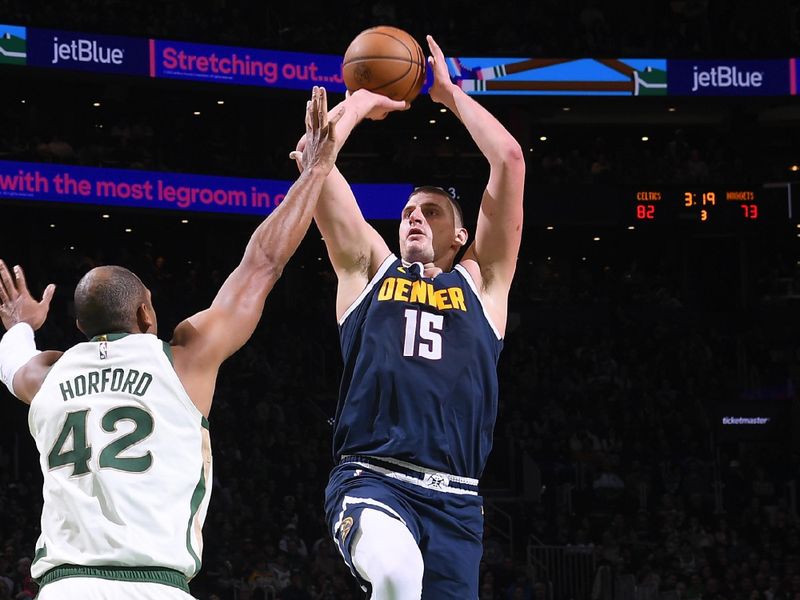 BOSTON, MA - JANUARY 19: Nikola Jokic #15 of the Denver Nuggets shoots the ball during the game against the Boston Celtics on January 19, 2024 at the TD Garden in Boston, Massachusetts. NOTE TO USER: User expressly acknowledges and agrees that, by downloading and or using this photograph, User is consenting to the terms and conditions of the Getty Images License Agreement. Mandatory Copyright Notice: Copyright 2024 NBAE  (Photo by Brian Babineau/NBAE via Getty Images)