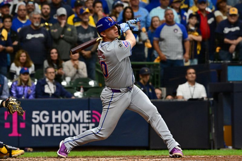 Oct 3, 2024; Milwaukee, Wisconsin, USA; New York Mets first baseman Pete Alonso (20) hits a three run home run against the Milwaukee Brewers in the ninth inning during game three of the Wildcard round for the 2024 MLB Playoffs at American Family Field. Mandatory Credit: Benny Sieu-Imagn Images