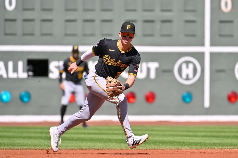 Aug 31, 2025; Boston, Massachusetts, USA; Pittsburgh Pirates third baseman Cam Devanney (34) tracks the ball during the first inning against the Boston Red Sox at Fenway Park. Mandatory Credit: Eric Canha-Imagn Images