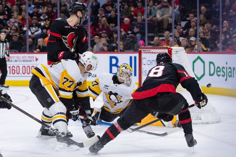 Dec 18, 2025; Ottawa, Ontario, CAN; Ottawa Senators center Tim Stutzle (18) shoots wide as Pittsburgh Penguins goalie Arturs Silovs (37) looks on in the first period at the Canadian Tire Centre. Mandatory Credit: Marc DesRosiers-IMAGN Images