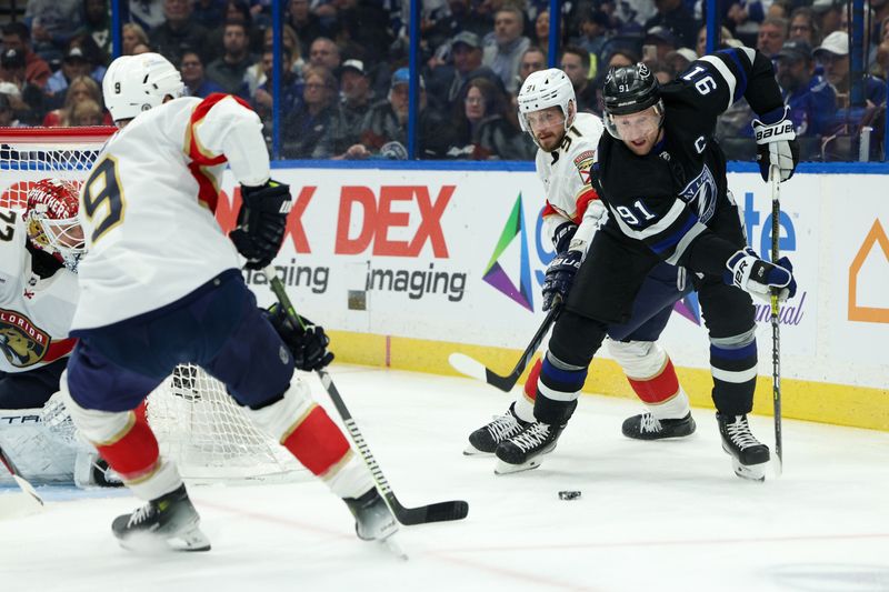 Feb 17, 2024; Tampa, Florida, USA;  Tampa Bay Lightning center Steven Stamkos (91) controls the puck  from Florida Panthers defenseman Oliver Ekman-Larsson (91) in the first period at Amalie Arena. Mandatory Credit: Nathan Ray Seebeck-USA TODAY Sports