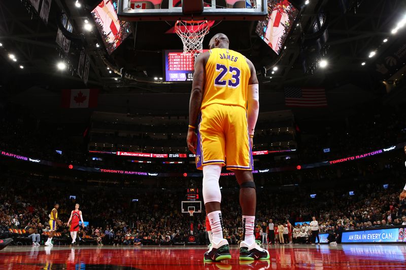 TORONTO, CANADA - NOVEMBER 1: LeBron James #23 of the Los Angeles Lakers standing on the court during the game against the Toronto Raptors on November 1, 2024 at the Scotiabank Arena in Toronto, Ontario, Canada.  NOTE TO USER: User expressly acknowledges and agrees that, by downloading and or using this Photograph, user is consenting to the terms and conditions of the Getty Images License Agreement.  Mandatory Copyright Notice: Copyright 2024 NBAE (Photo by Vaughn Ridley/NBAE via Getty Images)