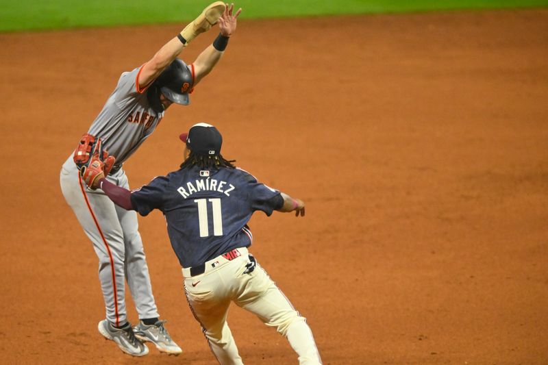 Jul 5, 2024; Cleveland, Ohio, USA; Cleveland Guardians third baseman Jose Ramirez (11) tags out San Francisco Giants second baseman Brett Wisely (0) in the ninth inning at Progressive Field. Mandatory Credit: David Richard-USA TODAY Sports