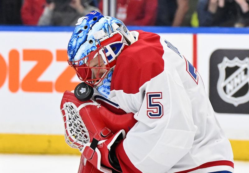 Apr 12, 2025; Toronto, Ontario, CAN;  Montreal Canadiens goalie Jakub Dobes (75) makes a save against the Toronto Maple Leafs in the first period at Scotiabank Arena. Mandatory Credit: Dan Hamilton-Imagn Images
