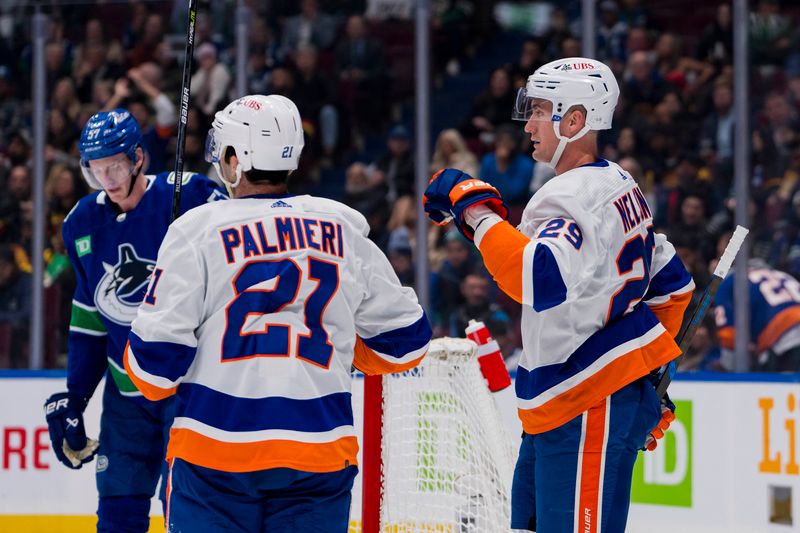 Nov 15, 2023; Vancouver, British Columbia, CAN; New York Islanders forward Brock Nelson (29) and forward Kyle Palmieri (21) celebrate Nelson   s goal against the Vancouver Canucks in the first period at Rogers Arena. Mandatory Credit: Bob Frid-USA TODAY Sports